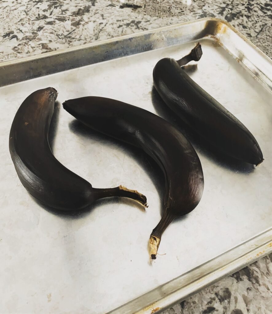 Blackened bananas on metal baking sheet